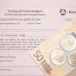 Das Bildzeigt einen Antrag auf Insolvenzgeld, auf dem zwei 50 Euro-Scheine und mehrere Euro-Münzen liegen